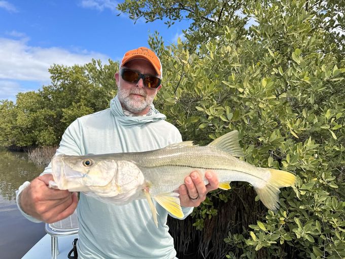 Angler holding a snook