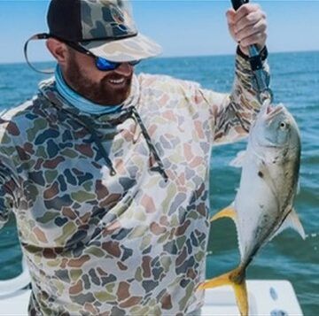 Angler holding a jack crevalle